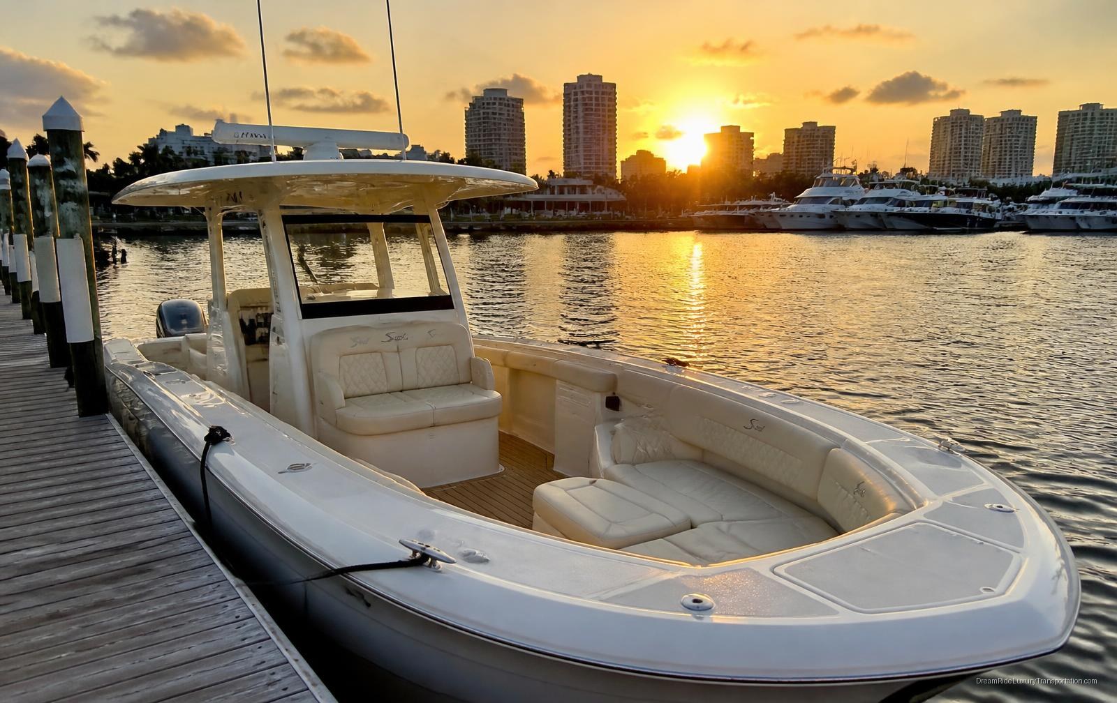 DreamRide charter yacht docked at a Fort Lauderdale marina at sunset with cushioned bow seating