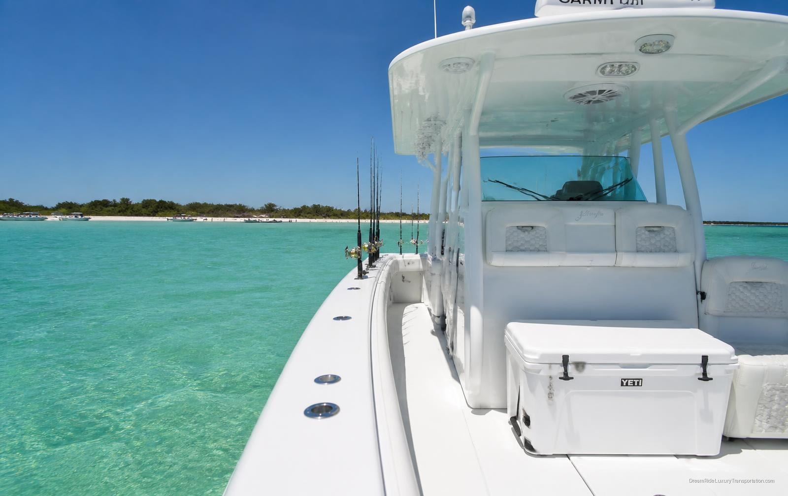 Deck and helm of the DreamRide charter yacht anchored on turquoise water off Fort Lauderdale
